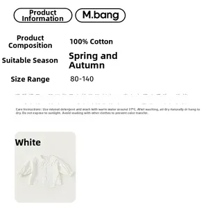 Detail view of white cotton girl's shirt showing 100% cotton material and ruffled collar