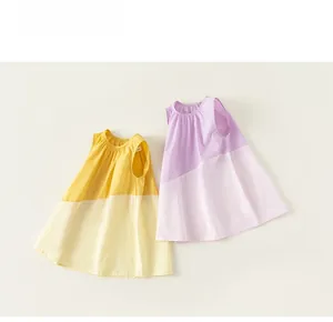 Detail of color-block sleeveless girls' A-line cotton dresses with pleated necklines