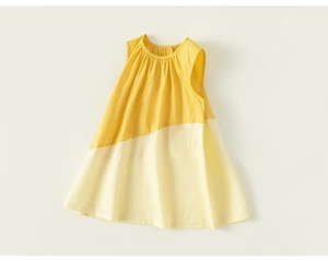 Detailed view of girls sleeveless A-line dress in contrasting yellow and beige cotton
