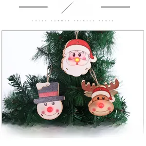 Detail of light-up wooden Christmas ornaments featuring Santa, Snowman and Reindeer