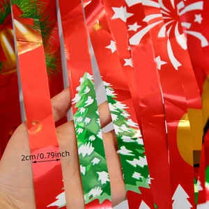 Detail of 2cm wide red Christmas tinsel curtain with stars, bells and tree patterns