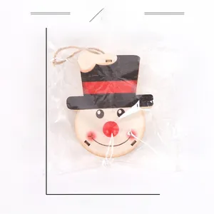 Detail of wooden snowman Christmas ornament in packaging with 13cm dimension markings