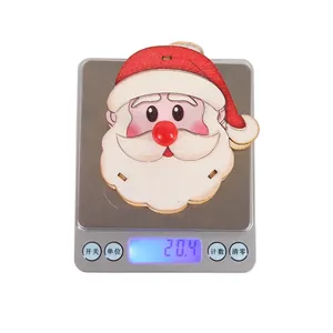 Detailed view of lightweight Santa wood ornament weighing 20.4g on a digital scale