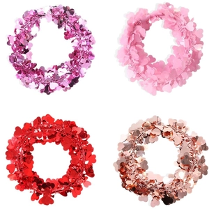 Set of four heart-shaped sequin wreaths in red and pink for Valentine's Day party decor