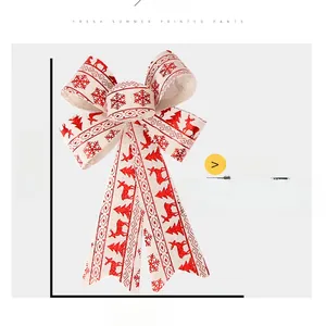 Detail of Christmas bow ornament with red reindeer print measuring 25cm by 17cm