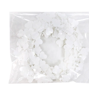 Handmade white heart-shaped wreath with multilayered leaves for Christmas decoration