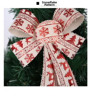 Close-up of rustic linen Christmas bow with red snowflake and reindeer patterns