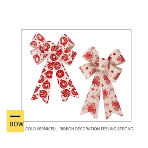 Detail of Christmas bows with red printed holiday patterns and thick linen texture