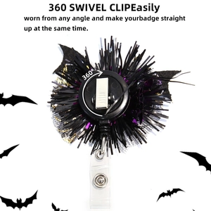 Halloween retractable badge reel with purple glitter pumpkin and black bat wing design