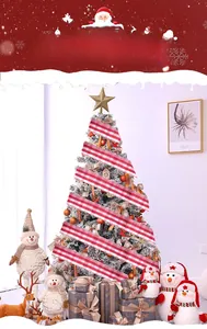 Detail of red and white plaid Christmas ribbon wrapped on a snow-covered festive tree