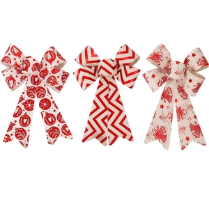 Set of three red and beige Christmas bows with festive patterns on a white background