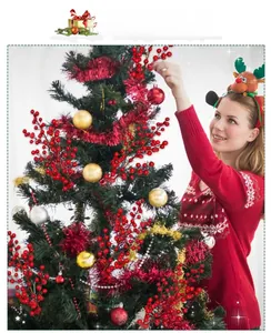 Detail view of vibrant red artificial Christmas berry branches used for tree decoration