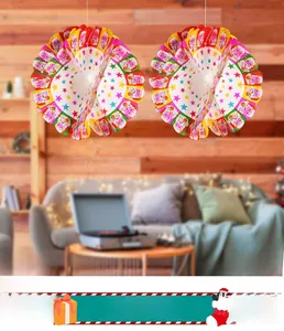 Close-up of festive Santa Claus honeycomb balls with colorful star and bell patterns