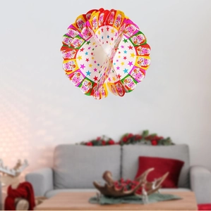 Detail of Santa Claus honeycomb paper ornament with stars and Merry Christmas text
