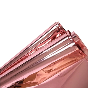 Detail of rose gold foil tablecloth with reflective metallic luster for party decoration