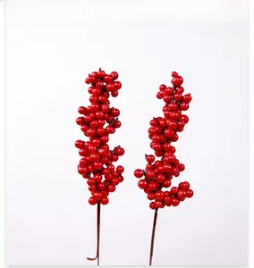 Close-up of artificial red berry branches for festive Christmas home decoration
