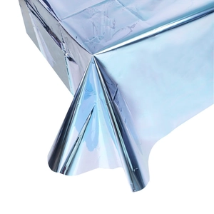 Detailed drape of light blue holographic metallic foil disposable tablecloth for parties