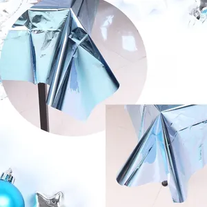 Detail showing the sky blue metallic foil texture and laser glossy effect of the tablecloth