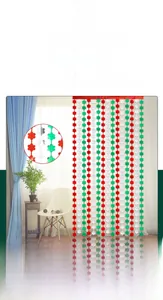 Detail of St. Patrick's Day shamrock foil curtain with red white and green clover sequins