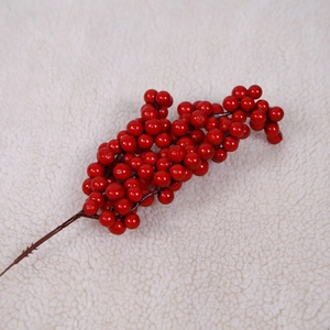 Artificial red berry stem for Christmas tree decoration and festive DIY floral arrangements