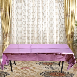 Detail of rose gold foil tablecloth showing metallic reflective surface on a rectangular table