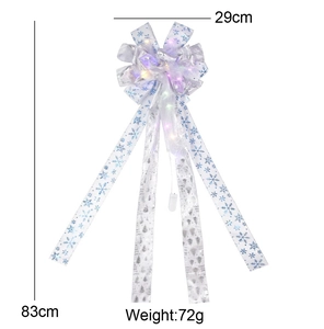 Detailed view of LED white Christmas bow with dimensions 29x83cm and snowflake patterns