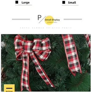 Detailed view of red and black plaid Christmas bows in large and small sizes on a tree