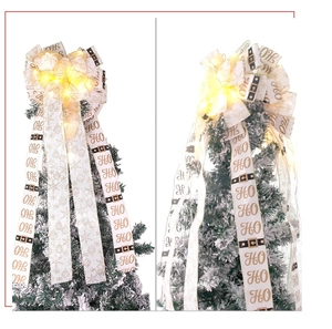 Macro detail of lighted white and gold Christmas bow with LED lights and festive prints