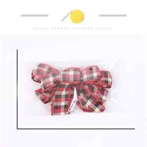 Detail of red and black buffalo plaid Christmas bow ornament, size 27.5cm x 16cm