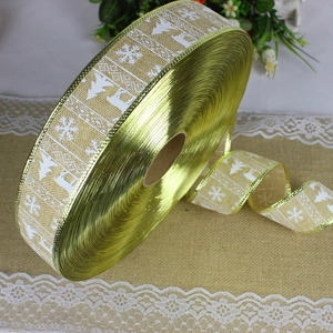 Detail of 2m Christmas burlap ribbon with white snowflake and reindeer prints