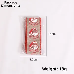 Detailed view of Christmas burlap ribbon with Santa HO HO HO print in retail packaging