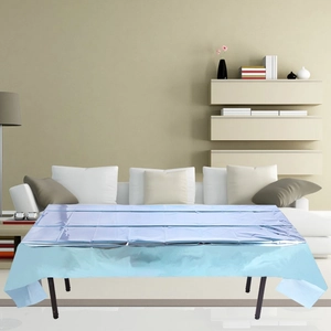 Close-up of metallic light blue disposable tablecloth for festive party decorations