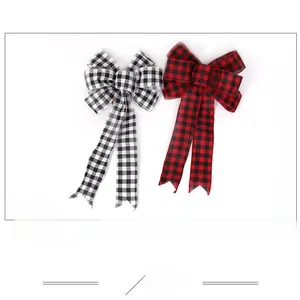 Detail of red and black buffalo plaid Christmas bows with elegant swallowtail cut design