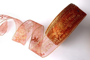 Detail of Christmas Greetings gold print on semi-transparent orange mesh ribbon with wire edge