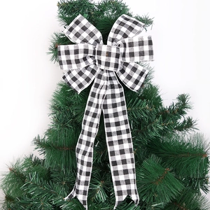 Black and white buffalo plaid Christmas tree topper bow made of polyester fabric