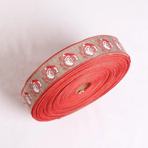 Close-up of Ho Ho Ho Christmas burlap ribbon roll for gift wrapping and party decor