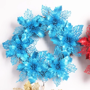 Sparkly blue artificial Christmas poinsettia wreath for festive holiday home decoration