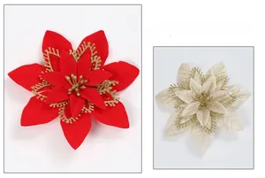 Detail of multi-layered Christmas poinsettia flower with sparkling gold glitter edges