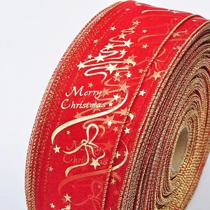 Red Christmas ribbon roll with gold Merry Christmas tree prints and wired gold edges