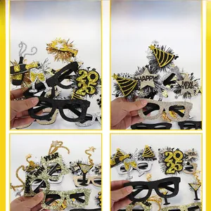 Detail shot of 2025 New Year party glasses with glitter stars and champagne motifs