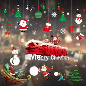 Close-up of Merry Christmas window stickers featuring Santa, snowman and snowflakes