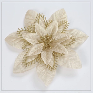 Close-up of champagne artificial poinsettia with gold glitter edges and detailed layers