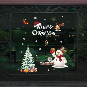 Detailed Christmas window decals showing reindeer, snowman, and tree on glass surface