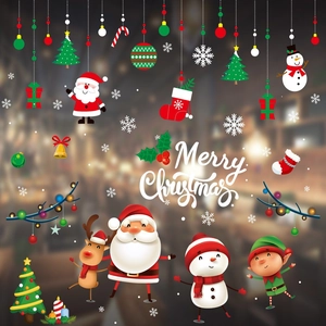 Detail of Merry Christmas window stickers featuring Santa, snowmen, and reindeer graphics