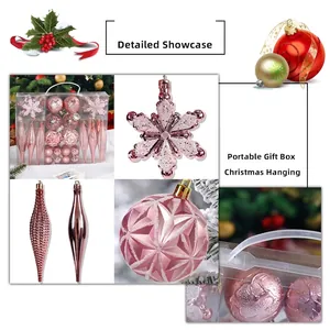 Pink Christmas tree ornaments set with snowflakes and icicles in a clear gift box