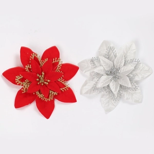 Detail of multi-layered red and white poinsettia flowers with glittering edges for decoration