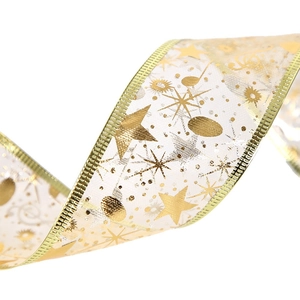 Translucent gold stamped organza ribbon with stars and music notes for gift wrapping