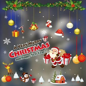 Detail view of festive Christmas window stickers featuring Santa, snowman, and reindeer
