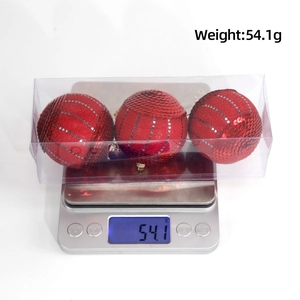 Set of three sparkling red glitter Christmas balls in packaging for tree decoration