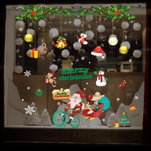 Detailed Christmas window stickers with Santa on bicycle and reindeer in red and gold hues